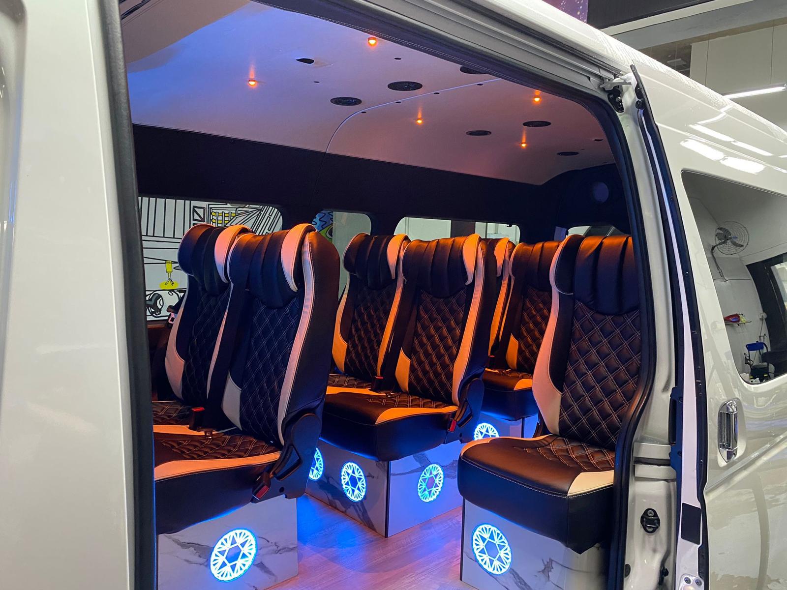 Executive MaxiCab cabin with orange accent seats