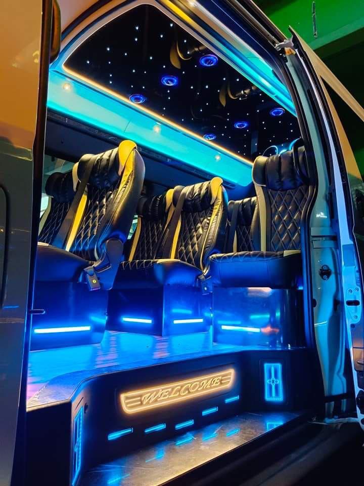 MaxiCab interior with blue ambient lighting and welcome lights